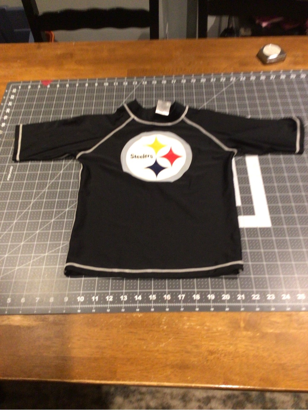 NFL Kids Black Rashguard with White, Yellow, Red, Blue Logo